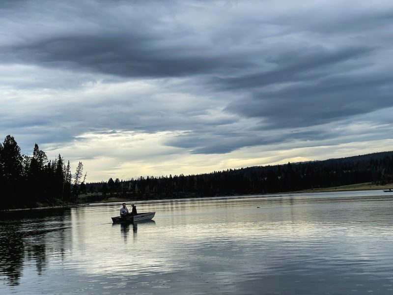 Anglers fishing from a small boat on Leighton Lake