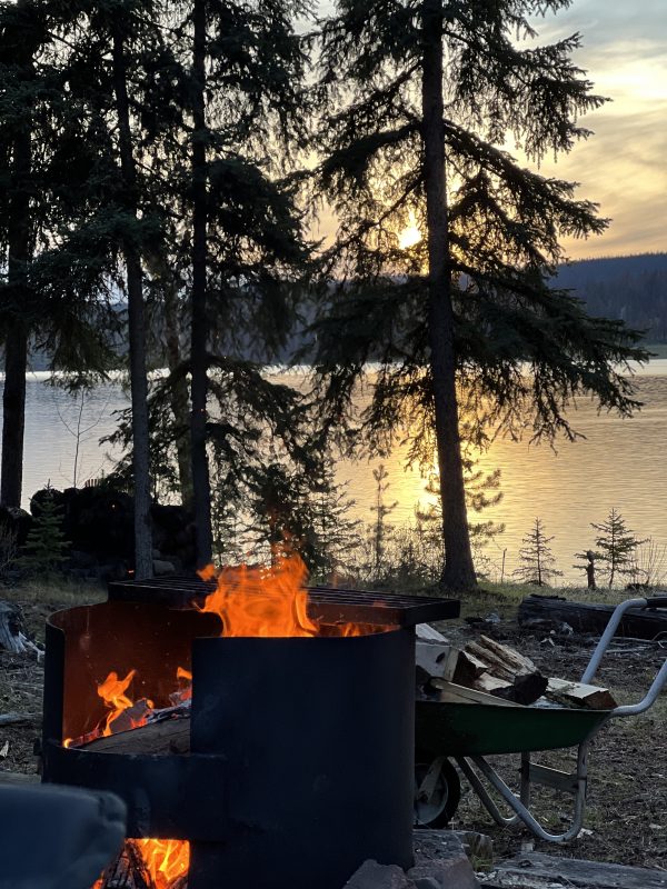 Campfire beside Leighton Lake at sunset