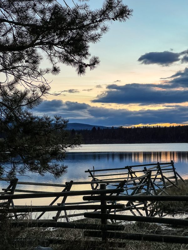 Rustic fence at the edge of Leighton Lake at dusk
