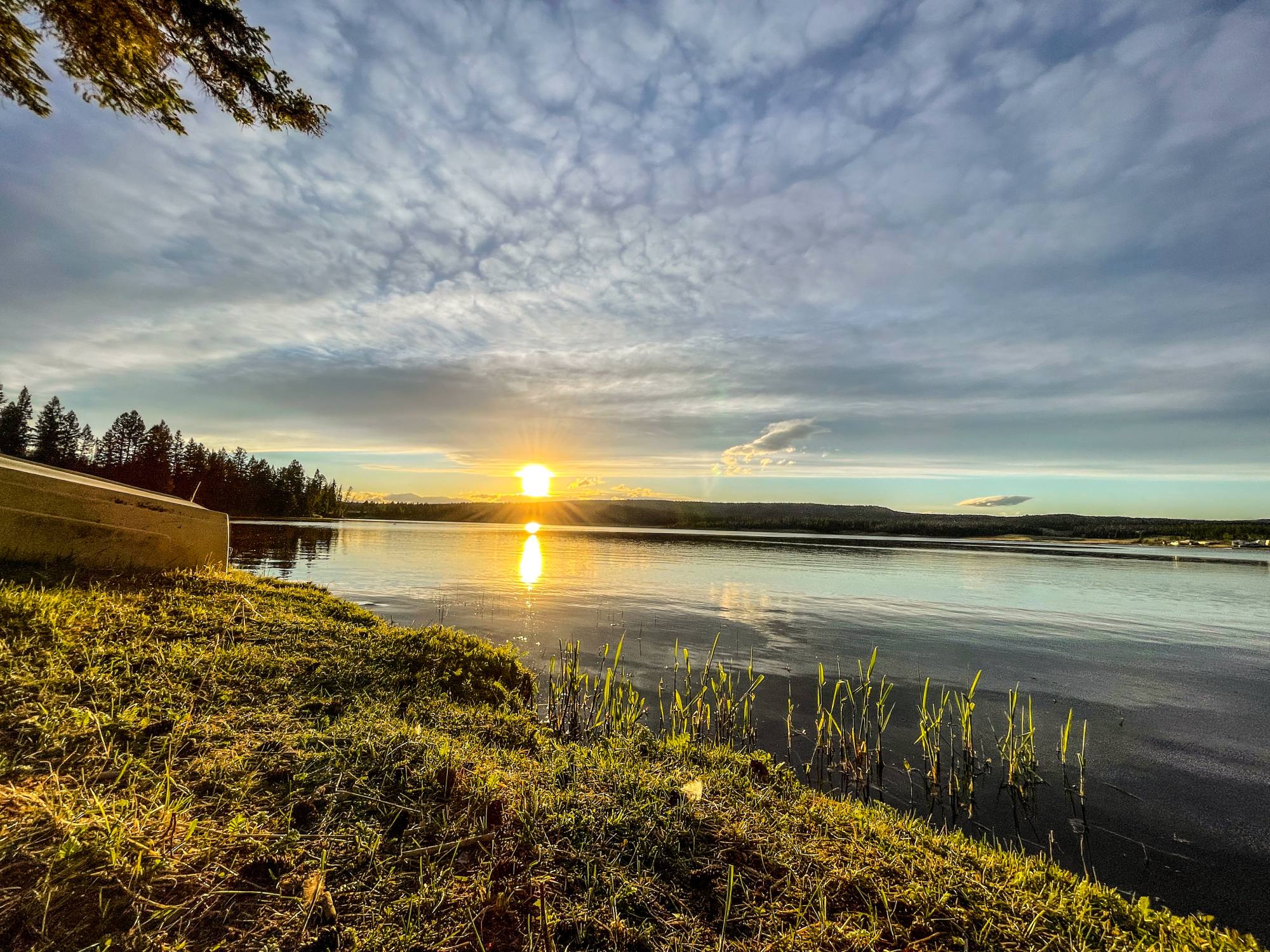 Sunset over Leighton Lake with golden light on calm water